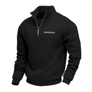 Detail of men's quarter-zip fleece hoodie with brown leather chest patch and ribbed cuffs