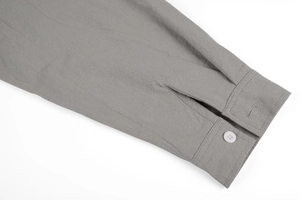Detail of the cuff with single button closure on a vintage linen long sleeve shirt