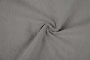 Detailed close-up of grey linen cotton fabric texture with natural weave pattern