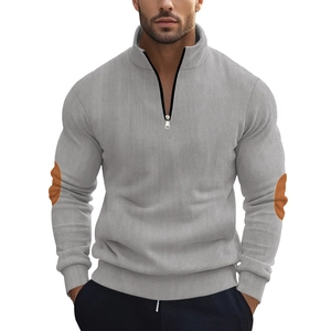 Men's light grey corduroy half-zip sweatshirt with orange elbow patches and ribbed cuffs