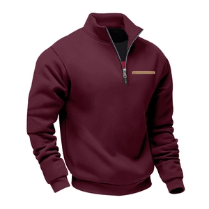 Detailed macro shot of a men's burgundy fleece pullover showing its collar and zipper