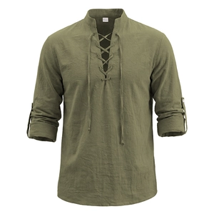 Detail of olive green vintage henley shirt with lace-up neckline and linen texture