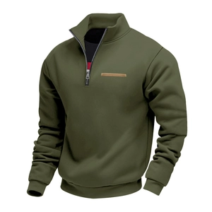 Detailed macro view of olive green fleece sweatshirt with zip collar and leather patch