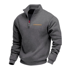 Detail of grey men's heavy fleece sweatshirt showing metal zipper and ribbed cuffs