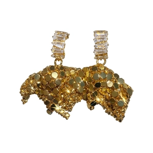 Elegant gold C-shaped hoop earrings with clear zircons and unique sparkling disc cluster.