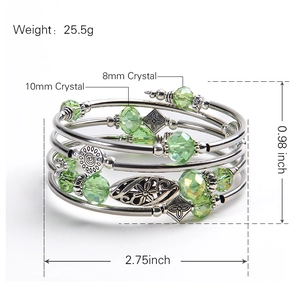 Multi-layer wrap bracelet with green crystal beads and silver-tone floral accents.