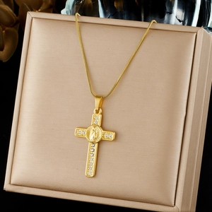Gold-plated stainless steel religious cross necklace with crystals displayed on jewelry box