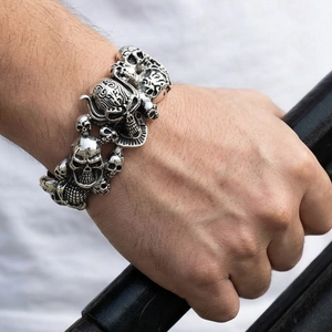Close-up of vintage skull bracelet in oxidised steel on model's wrist with punk vibes