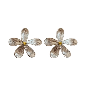 Elegant French style silver flower stud earrings with a minimalist golden center design