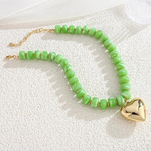 Summer beach style necklace with green marbled resin beads and big gold heart pendant