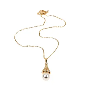 Elegant gold necklace with fan-shaped zircon pendant and round white pearl charm
