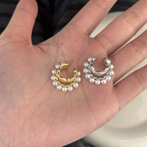 Detailed view of elegant zircon pearl C-shaped ear clips in gold and silver finish