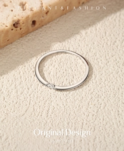 Detail view of a minimalist S925 sterling silver ring with a marquise moissanite stone accent