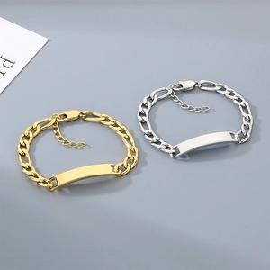 Detailed view of minimalist gold and silver NK chain bracelets with engravable plates