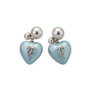 Stylish light blue heart stud earrings featuring a silver bow and elegant pearls