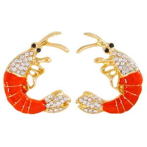 Detailed view of gold-tone lobster earrings with orange enamel and sparkling rhinestones