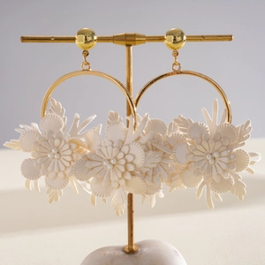 Elegant cream leather flower hoop earrings with gold finish and tiny pearl details