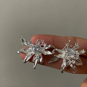 Elegant 3D flower stud earrings with sparkling white zircons in a silver finish