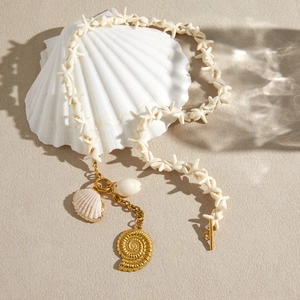 Elegant titanium steel starfish necklace with shell and gold ammonite pendant