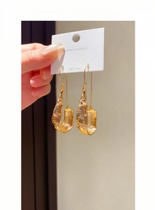 Golden textured U-shaped drop earrings with retro design and S925 silver hooks.