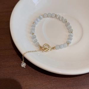 Elegant cat's eye stone adjustable bracelet with gold-tone T-bar clasp for women