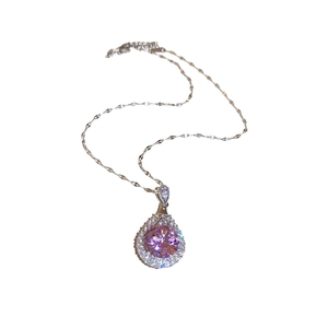Elegant silver-toned necklace featuring a pink teardrop-shaped zircon pendant