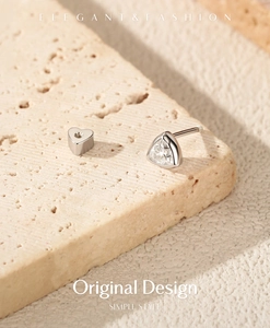 Close-up of S925 sterling silver moissanite stud with heart-shaped screw back