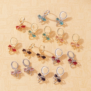 Detailed view of multiple bowknot hoop earrings featuring colorful cubic zirconia stones