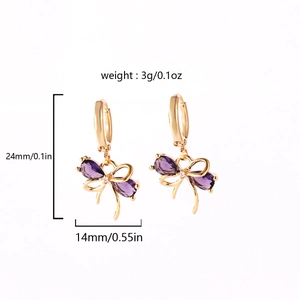 Close-up view of gold-plated bow earrings with purple zircons and product size dimensions