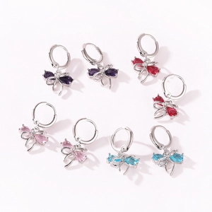 Group of colorful bow-shaped earrings with sparkling cubic zirconia charms
