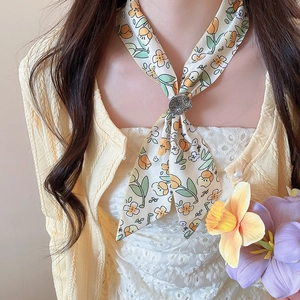 Close-up of French floral tulip silk scarf necklace with elegant metal ring buckle