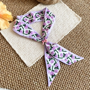 Elegant French tulip floral print silk scarf necklace with a sweet pink bow detail.