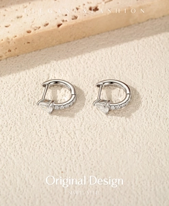 Close-up of S925 sterling silver hoop earrings featuring clear water drop moissanite stones.
