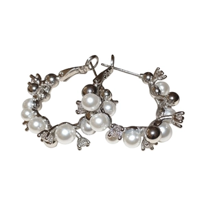 Elegant silver-tone hoop earrings with pearls and shimmering zircons for women.