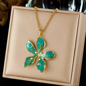 Elegant gold-plated necklace with turquoise enamel flower pendant and pearl accents