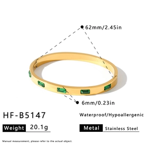 Gold stainless steel bangle dimensions with green rectangular gems, 62mm diameter and 6mm width