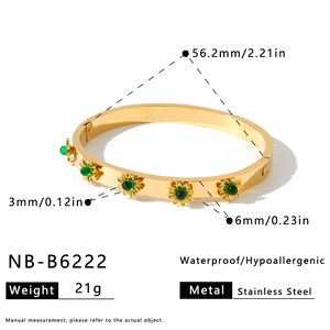 Detail view of gold stainless steel bangle with green flower charms and dimensions