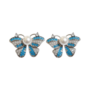 Elegant silver needle butterfly stud earrings featuring blue zircons and central pearl