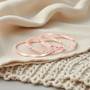Set of three 1mm rose gold stainless steel rings with geometric diamond cut details