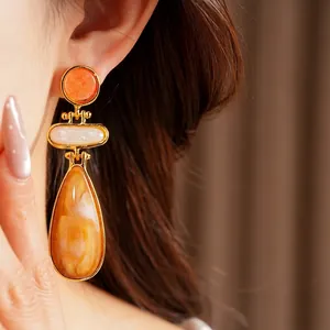 Elegant vintage orange resin waterdrop earrings with gold-toned metal for women's fashion