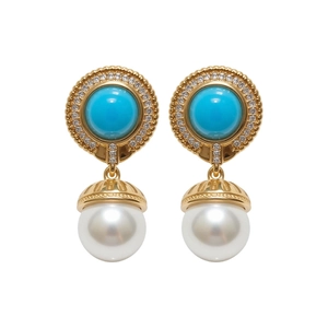 Elegant vintage geometric earrings featuring blue cabochon stones and white pearl drops.