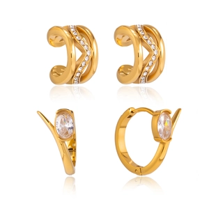 Set of gold-plated stainless steel earrings and ear cuffs featuring oval cubic zirconia stones.