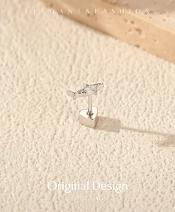 Detail view of S925 sterling silver shark ear bone stud with moissanite and screw back