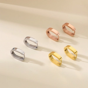 Minimalist stainless steel U-shaped hoop earrings in gold, silver, and rose gold.