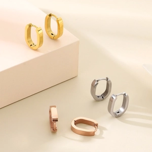 Minimalist U-shaped stainless steel hoop earrings in gold, silver, and rose gold finishes.