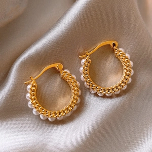 Elegant French vintage gold hoop earrings featuring delicate pearl accents on silk