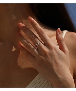 Detailed view of a minimalist S925 sterling silver double-layered ring with moissanite