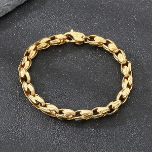 Macro view of a gold-plated stainless steel corn chain bracelet for men with lobster clasp.