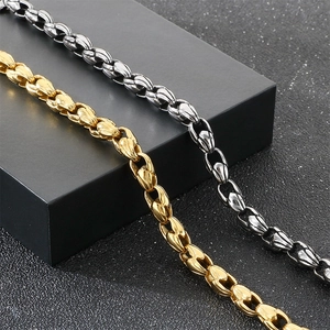 Close-up of vintage stainless steel corn link bracelets in gold and silver finish