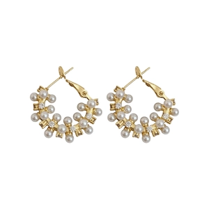 Elegant French style gold hoop earrings decorated with delicate white pearls and zircons